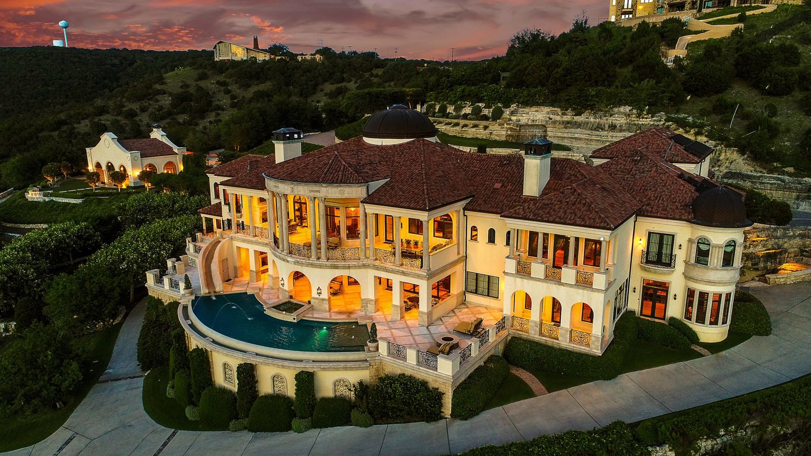 Hilltop mansion above the lake from the air