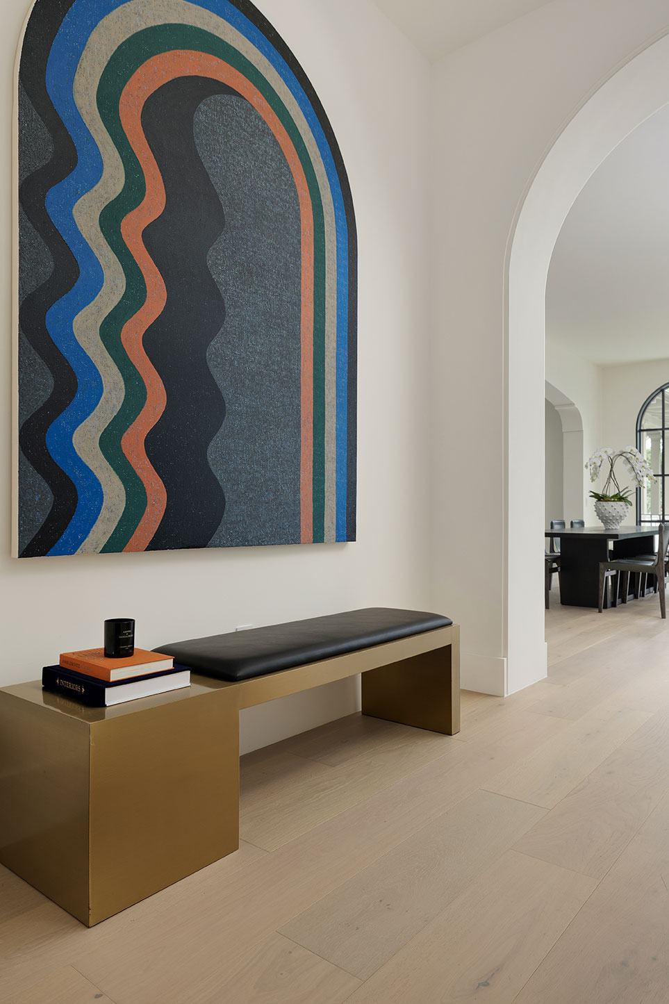 Hallway with an arched niche and a bench