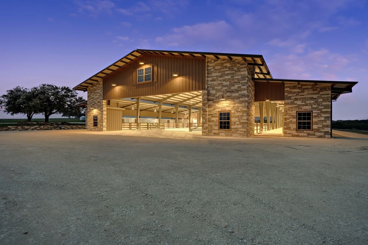 Stone and steel barn at dusk