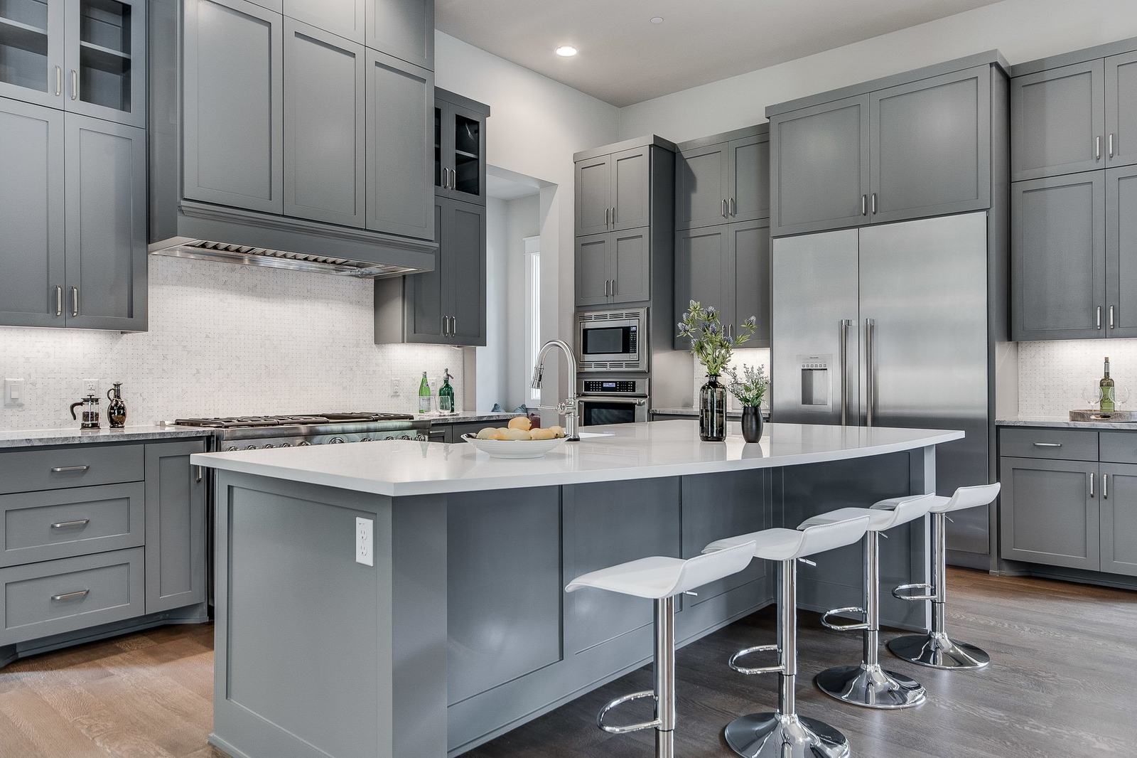 Model-unit kitchen with grey cabinetry and city views