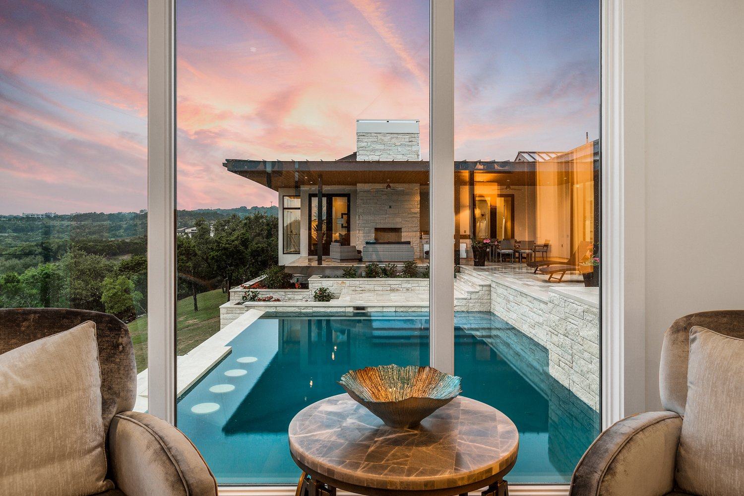 Courtyard pool at twilight with a fountain