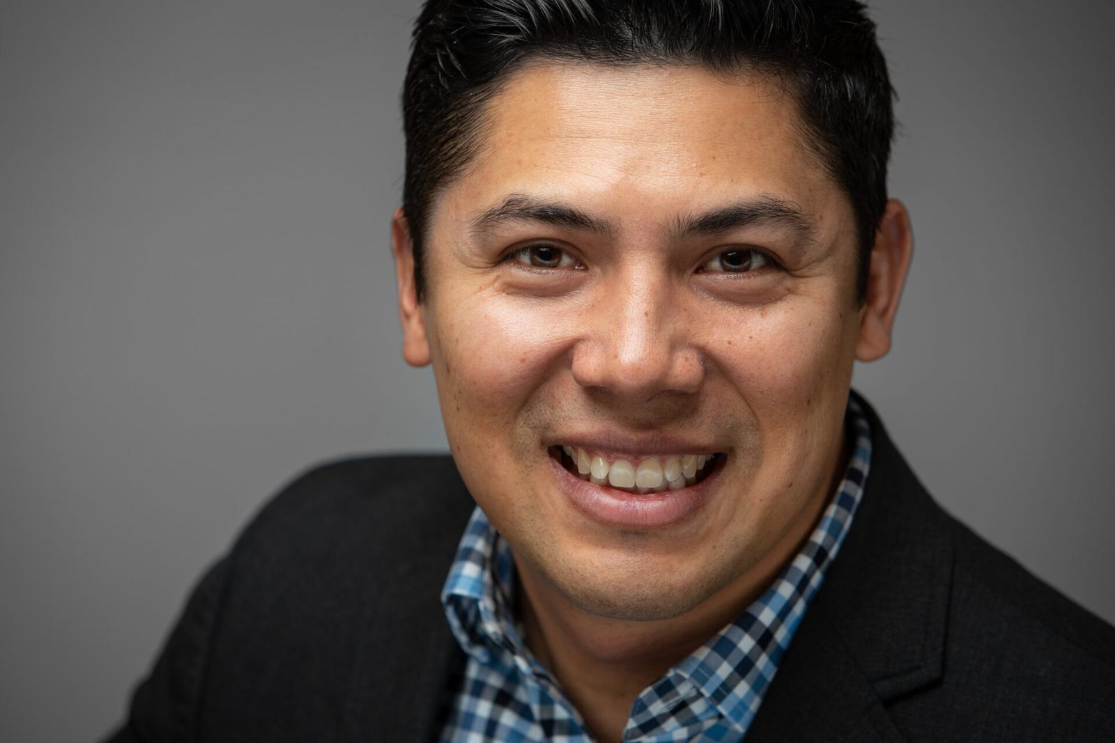 Realtor headshot, studio, dark background