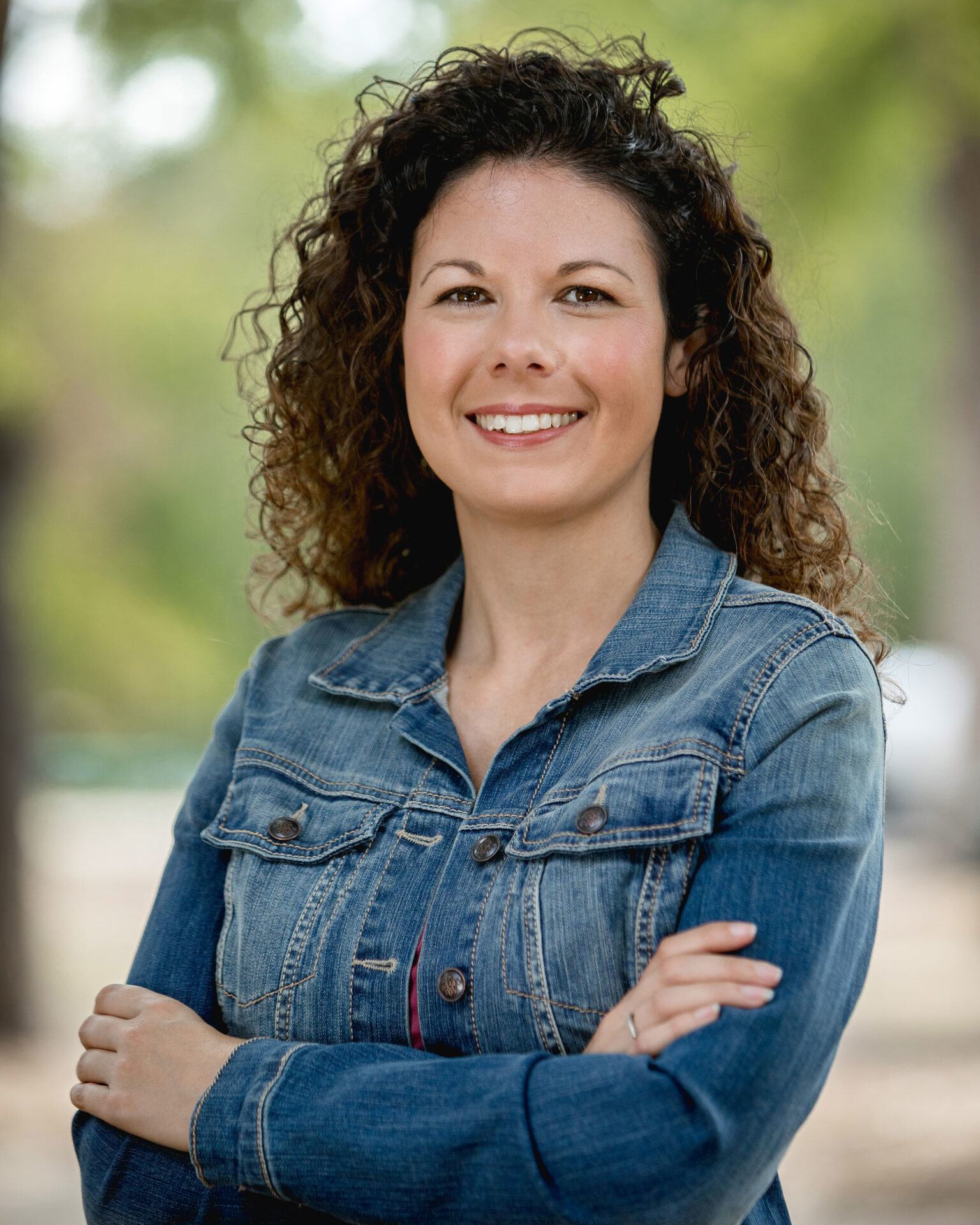 Realtor headshot outdoors, denim jacket