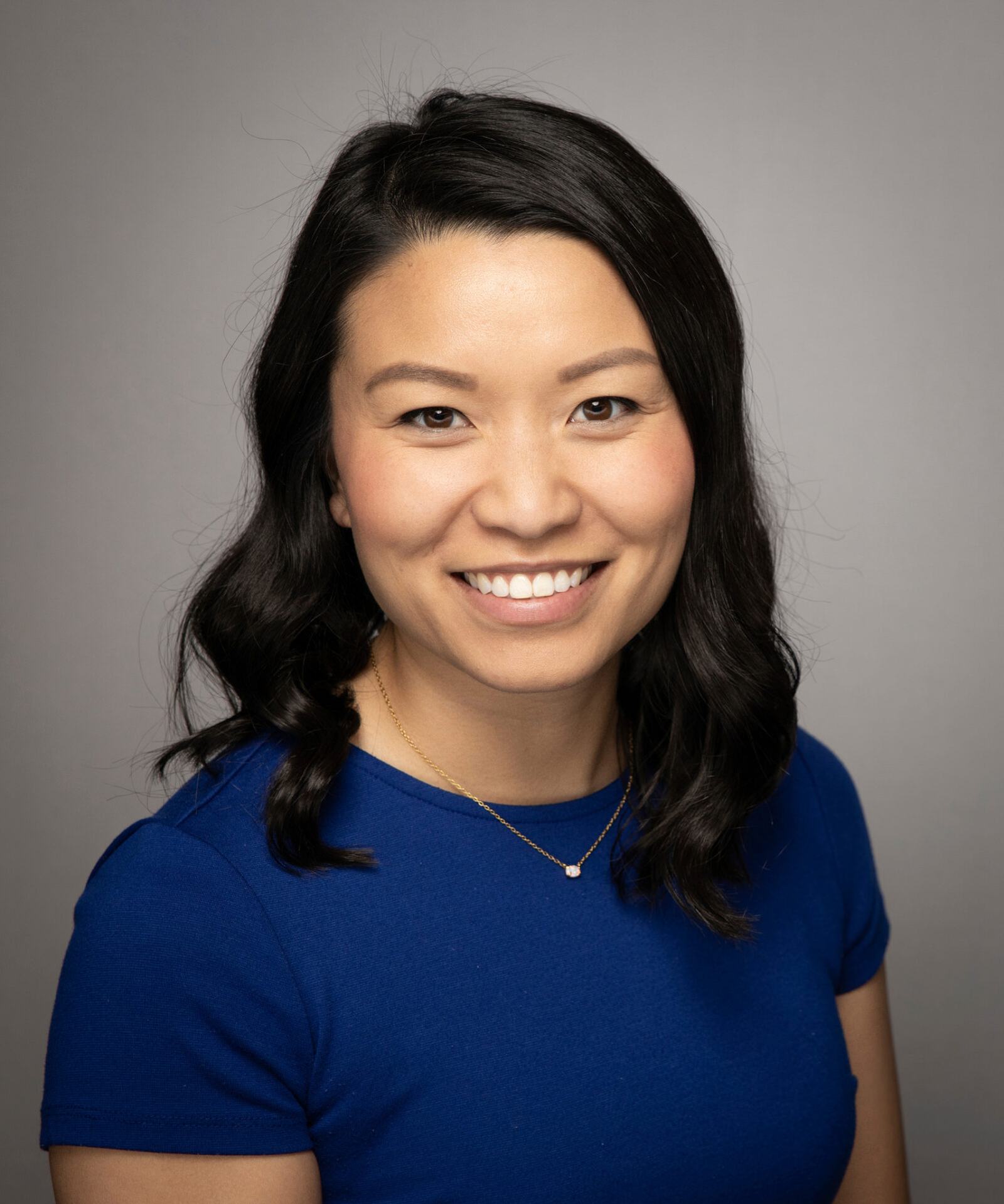 Realtor headshot, studio, warm background