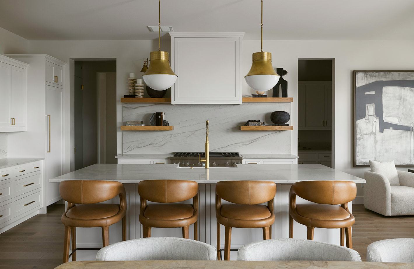 Modern kitchen with walnut cabinetry and a long island in warm afternoon light
