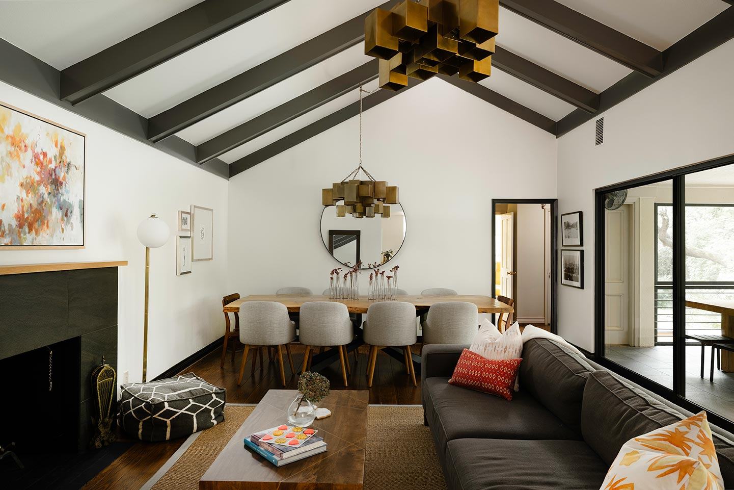 Living room with a dark beamed ceiling