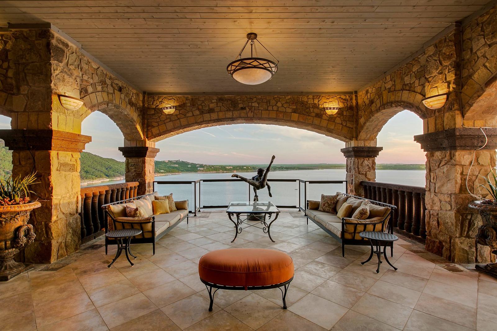 Covered stone porch looking out over the lake