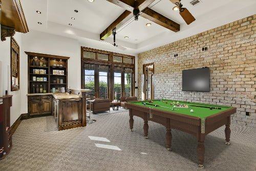 The same room virtually staged with a pool table